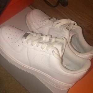 Nike Air Force ones in white.
